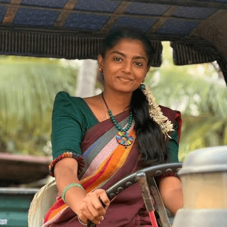 Karunya Gunavathy smiling, seated in a boat